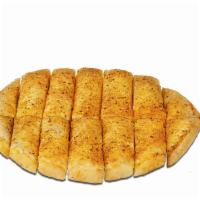 Medium Bread Sticks · Garlic Butter , Special Blend of Italian Spices
On a Pan Crust  Includes Dipping Sauces