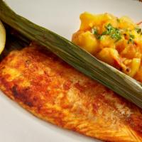 Striped Bass Fillet · A skinless fillet of striped bass is marinated in coconut, tamarind, fennel, and black peppe...