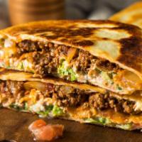 Quesadillas · 2 delicious quesadillas. Choose from cheese, chicken, beef steak, ground beef or shrimp. Ser...