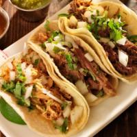 Street Tacos 2Go · 2 tacos filled with your choice of beef, chicken or shrimp, topped with onnions and cilantro...