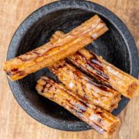 Churros · The most popular Mexican dessert. Order of four fried pastries made from an unsweetened doug...