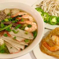 Hu Tieu  Dai · Clear chewy noodle soup with ground pork, sliced Chasiu pork, shrimps, calamari, quail egg, ...
