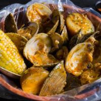Boiled Little Neck Clam (1 Lb) · Served with corn and potatoes and a choice of sauce.