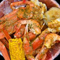 1 Lb Snow Crab Leg & 1 Lb Shrimp (Headless Only )Or 1 Lb Crawfish · Served with corn and potatoes.