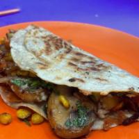 El Veggie! · Flour tortilla, queso, veggie blend including calabacitas, elote and mushrooms