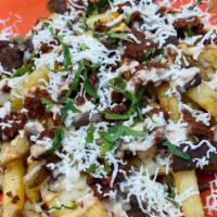 Campechana Fries · Fries covered in melting cheese, bistec, chorizo, queso fresco, chipotle crema, cilantro