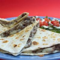 Quesadillas · Flour tortilla, with your choice of taco meat, with melted cheese. Served with lettuce, toma...