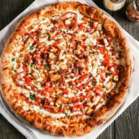 Chicken Bacon Ranch · Garlic chicken, bacon crumbles, Canadian bacon and cooked tomatoes atop a ranch base. Finish...