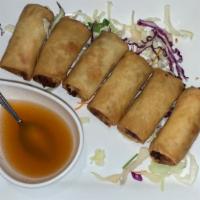 Spring Rolls · Stuffed with glass noodles, tofu, a variety of vegetables and golden fried served with Thai ...