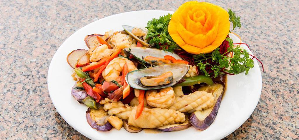 Spicy Seafood With Basil · Spicy. Sautéed shrimp, scallops, calamari, mussels with pepper, fresh garlic, basil, and house chili garlic paste served with eggplants.