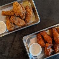 Fried Chicken Wings · 6 pieces per order. Choice of House BBQ, Lemon Pepper, Sweet Sesame Chili, Honey-Habanero Be...