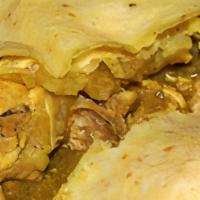 Curry Chicken Roti · Boned Curry chicken with potato and carrots wrapped in roti bread