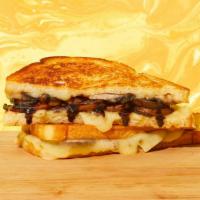 Mushroom Grilled Cheese · Melted swiss cheese, roasted mushrooms, caramelized onions, balsamic vinegar, and mayo betwe...