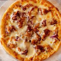 Barbecue Chicken Pizza · Crispy chicken tossed in BBQ sauce with cheese, onions and bacon.