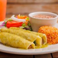 Vegan Spinach Enchiladas · Spinach, mushrooms, tomatoes & onion filled corn tortilla enchiladas, topped with ranchera o...
