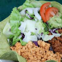Taco Salad · Baked flour shell, soy-rizo, lettuce, mexican brown rice, guacamole, beans & cheese (NF)