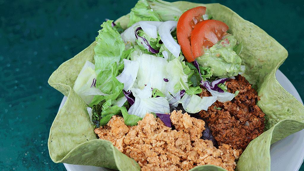 Taco Salad · Baked flour shell, soy-rizo, lettuce, mexican brown rice, guacamole, beans & cheese (NF)