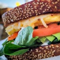 Vegan Breakfast Sandwich · Breakfast sandwich with couce of avocado or vegan bacon, spinach, tomatoes, vegan egg & vega...