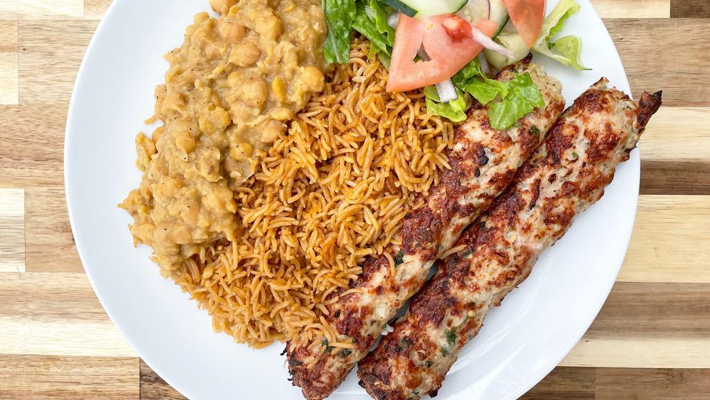 Chicken Seekh Kabob Platter · Ground Chicken with traditional spices, slow cooked on a skewer to perfection. Comes with rice, salad, mint yogurt chutney sauce, naan bread, & channa masala.