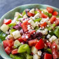 Greek Salad · Romain lettuce, tomatoes, cucumbers, feta cheese, kalamata olives and red onions.