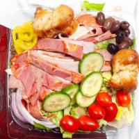 Antipasta Salad · Our garden salad topped with Italian cold cuts and sharp provolone cheese.