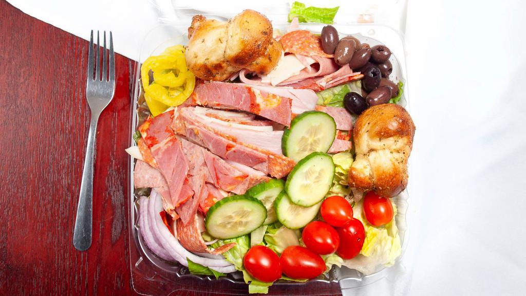 Antipasta Salad · Our garden salad topped with Italian cold cuts and sharp provolone cheese.