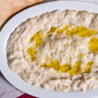 Baba Ghanoush · Eggplant blended with tahini served with bread.
