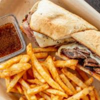 French Dip · Thinly sliced beef, sautéed mushrooms, onions, and provolone served on a toasted hoagie bun ...