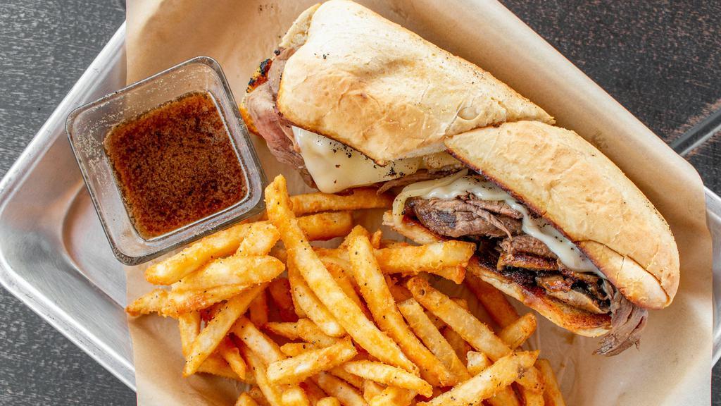 French Dip · Thinly sliced beef, sautéed mushrooms, onions, and provolone served on a toasted hoagie bun with au jus.