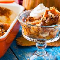 Pumpkin Bread Pudding · Sliced bread smothered in mounds of pumpkin pie filling and topped with nutmeg and cinnamon....