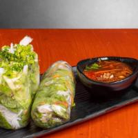Herb Spring Rolls · Vermicelli, lettuce, mint, cucumber and fried shallot wrapped in rice paper. Served with hou...