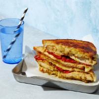 The Chicken Pesto · Melted Swiss and Jack cheese with chicken, pesto, and roasted red peppers grilled between tw...
