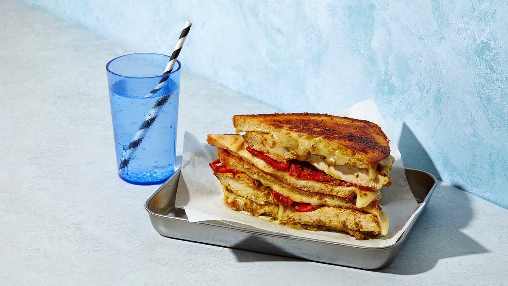 The Chicken Pesto · Melted Swiss and Jack cheese with chicken, pesto, and roasted red peppers grilled between two slices of buttered bread.