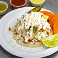 Sope · Hand made Corn tortilla, Choice of meat, Beans, Lettuce, Tomato, Sour cream, Avocado, Cheese.