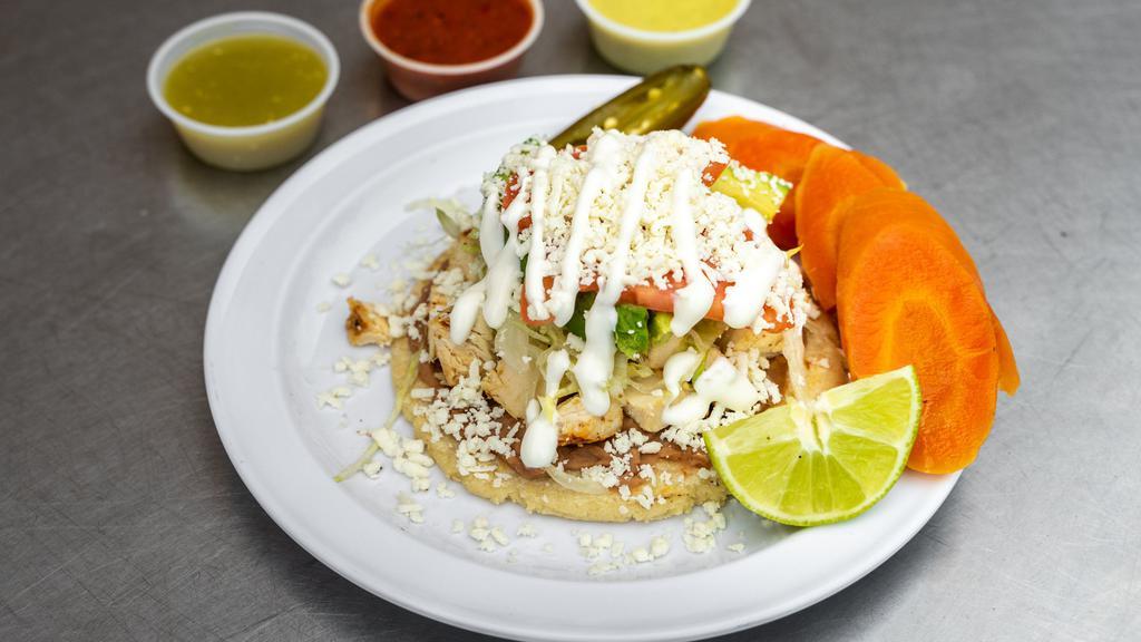 Sope · Hand made Corn tortilla, Choice of meat, Beans, Lettuce, Tomato, Sour cream, Avocado, Cheese.