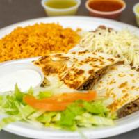 Kids Special · Quesadilla or Bean & Cheese Taco, Rice, Beans, 16oz. Drink.
