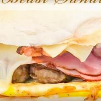The Beast · 2 Eggs, Extra Cheese, Ham, Bacon and Sausage on a Portuguese Roll