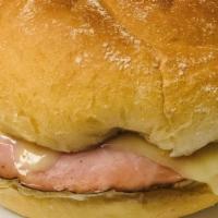 Calise Sandwich · Made with, ham, bacon, egg, and pepper Jack cheese.