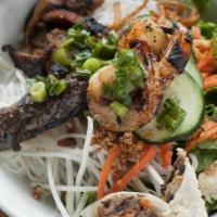 Combo Vermicelli Noodles · Grilled draper valley chicken thigh, shrimp, house-made beef and pork sausage, crispy imperi...