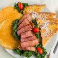 Pancake Platter · Two pancakes, choice of meat, two eggs any style, home fries or grits.