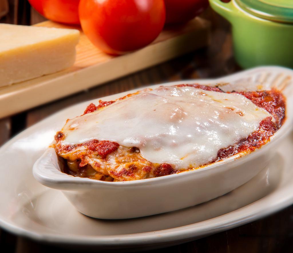 Homemade Lasagna · Spicy Italian sausage smothered with cheese & baked in our home made tomato sauce.