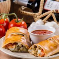 Classic Stromboli · Rolled Pizza dough stuffed with pepperoni, Italian sausage, beef, green peppers, onions & mo...