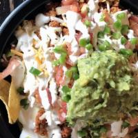 Nachos · Your choice of chicken, steak, carnitas, or chorizo with re-fried black beans, queso, pico d...