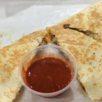 Quesadillas · Choice of chicken, steak, carnitas, served with sour cream.