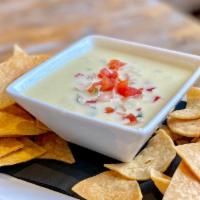 Poblano Queso Dip · MELTED QUESO | SERRANO PEPPERS | JALAPEÑO PEPPERS | POBLANO PEPPERS | PICO DE GALLO
