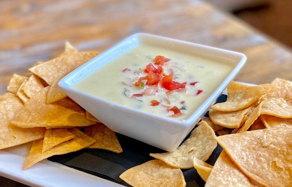 Poblano Queso Dip · MELTED QUESO | SERRANO PEPPERS | JALAPEÑO PEPPERS | POBLANO PEPPERS | PICO DE GALLO