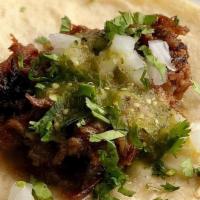 Duck Tacos. · DUCK MARINATED WITH ORANGE | SALSA VERDE | ONIONS | CILANTRO