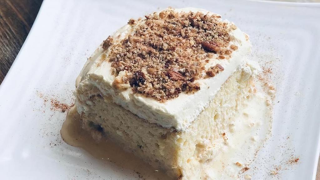 Tres Leches. · Homemade Mexican sponge cake soaked with three milks and topped with pecans.