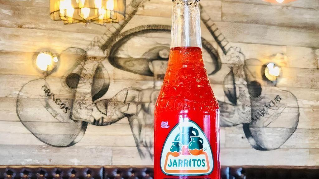 Jarritos Fruit Punch · Made with Jarritos' special blend of fruits and 100% real sugar. Bottle opener required to open. 12 fl. oz