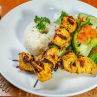 Chicken Anticuchos · Marinated grilled meat on skewers. Served with rice.